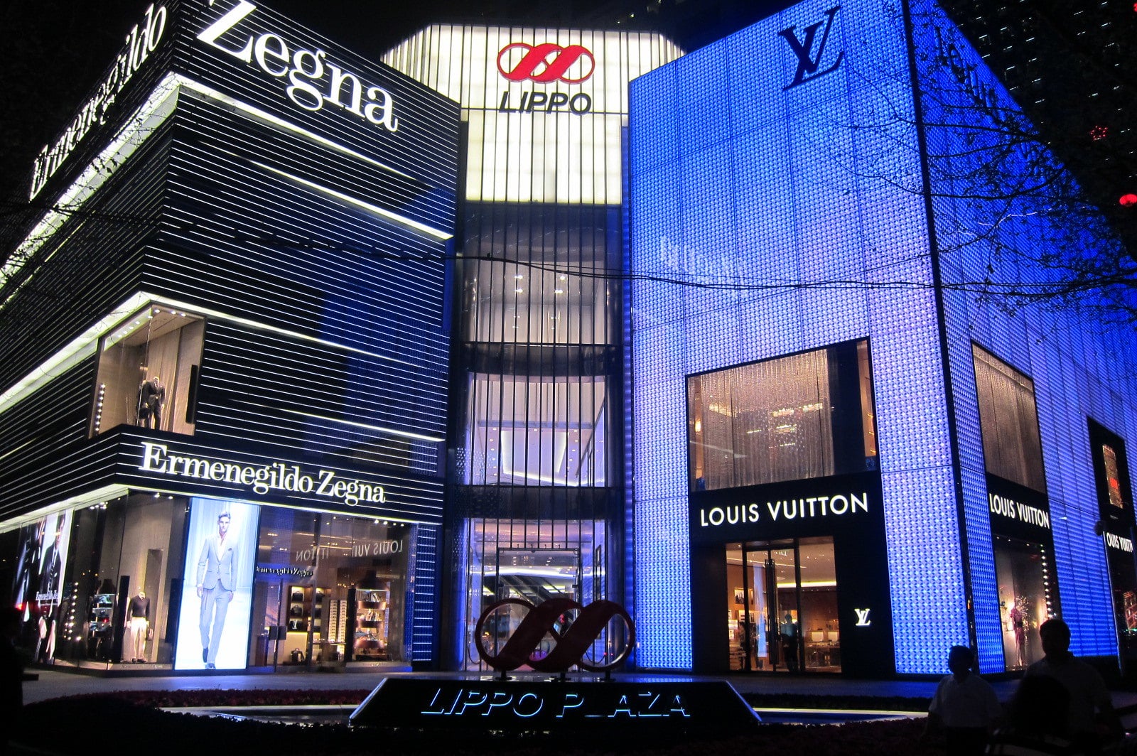 FILE--Customers walk past a boutique of Louis Vuitton (LV) in Shanghai,  China, 3 October 2017. Global luxury brands from Prada to LVMH are invest  Stock Photo - Alamy